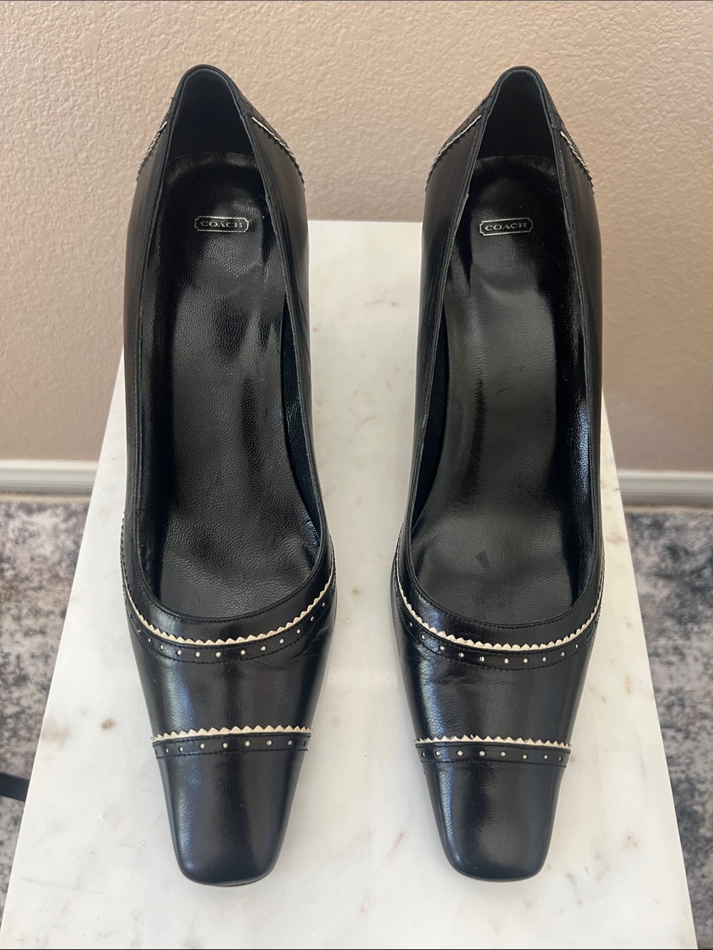 Coach Black Leather Pointed Toe Heels with Metallic Accent